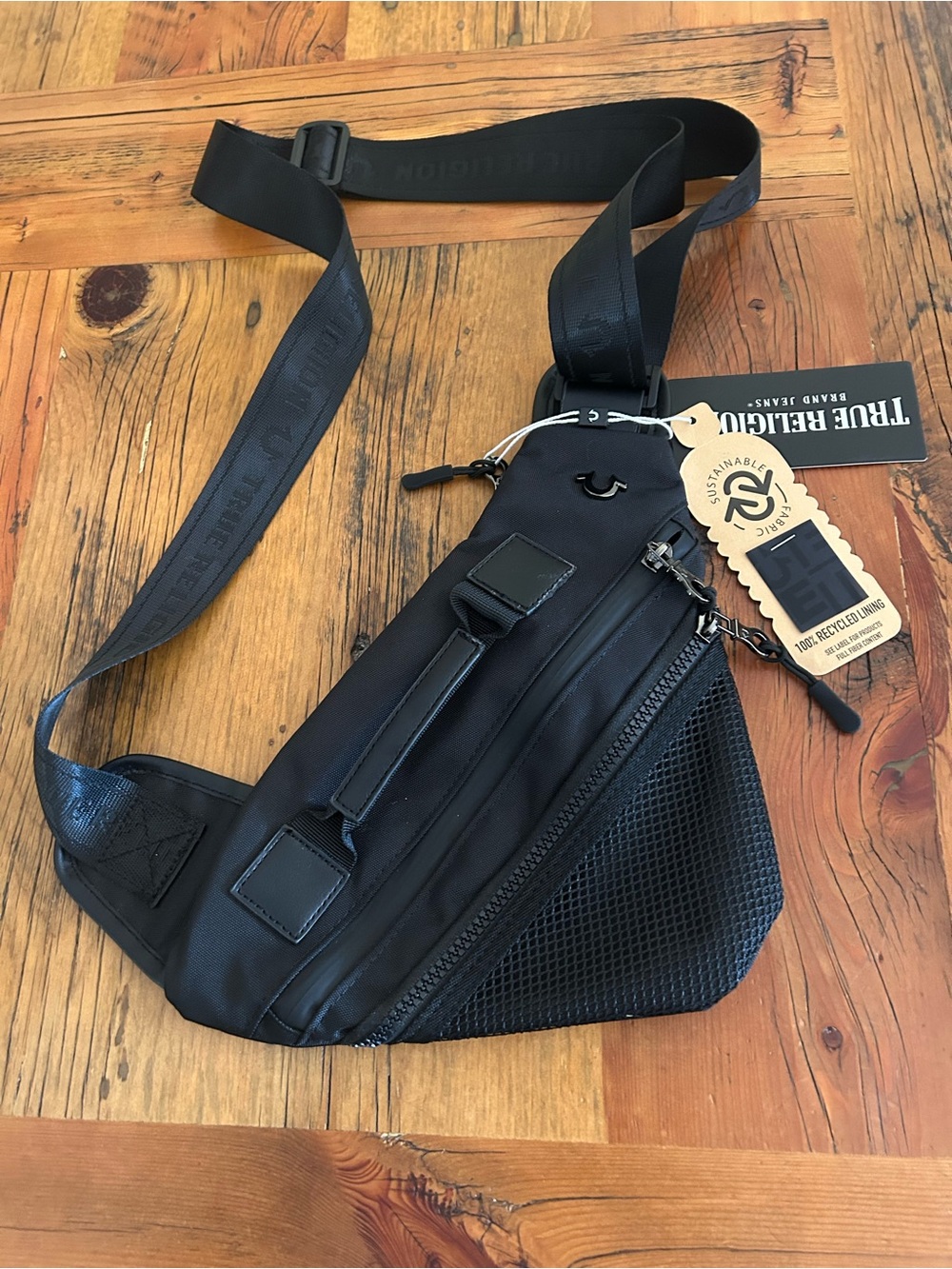 True Religion Women’s/Men’s Sarge Sling Crossbody Bag with Mesh Pocket